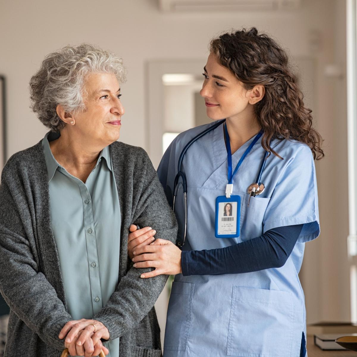 Healthcare professional providing personalized care to an older patient during a physician-supervised medical consultation